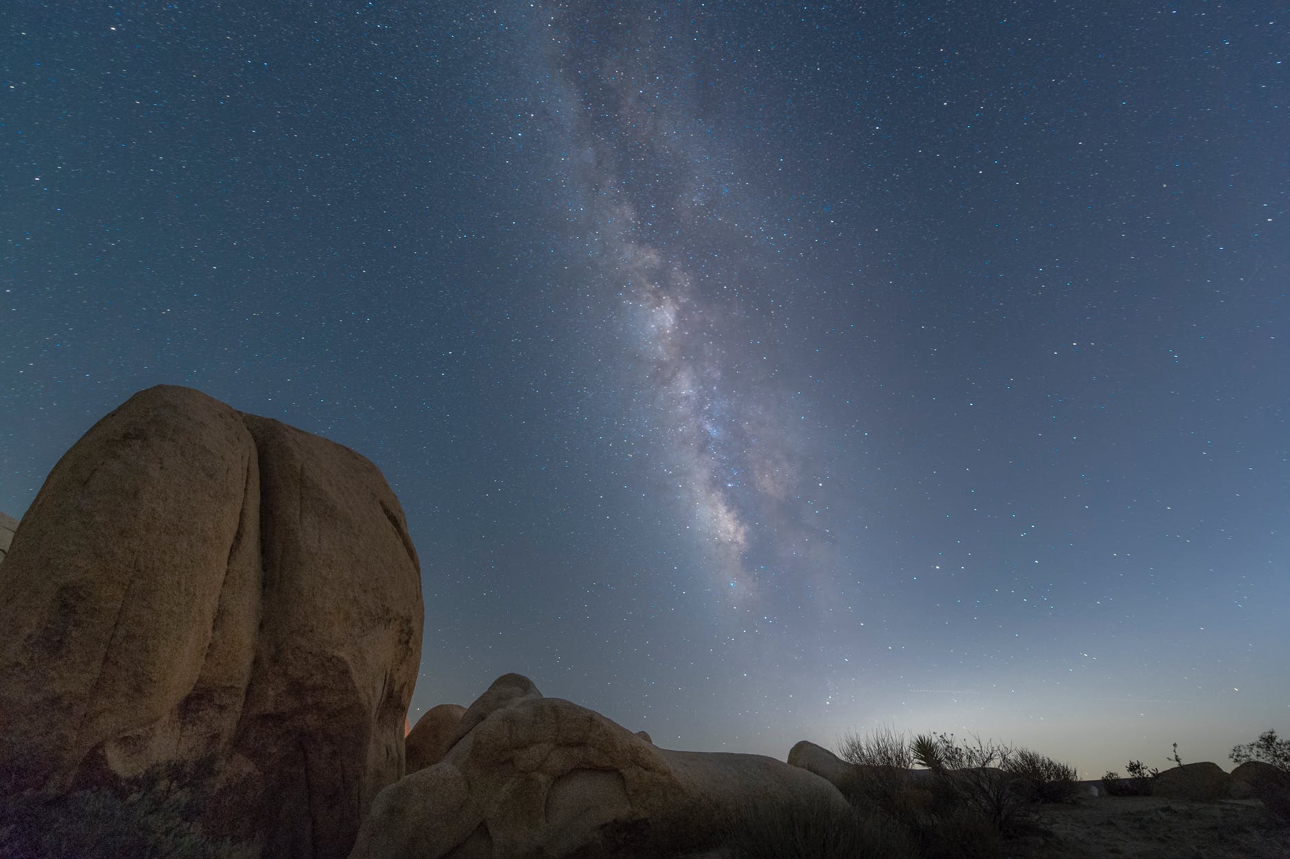 brown rock formation under blue sky during night time