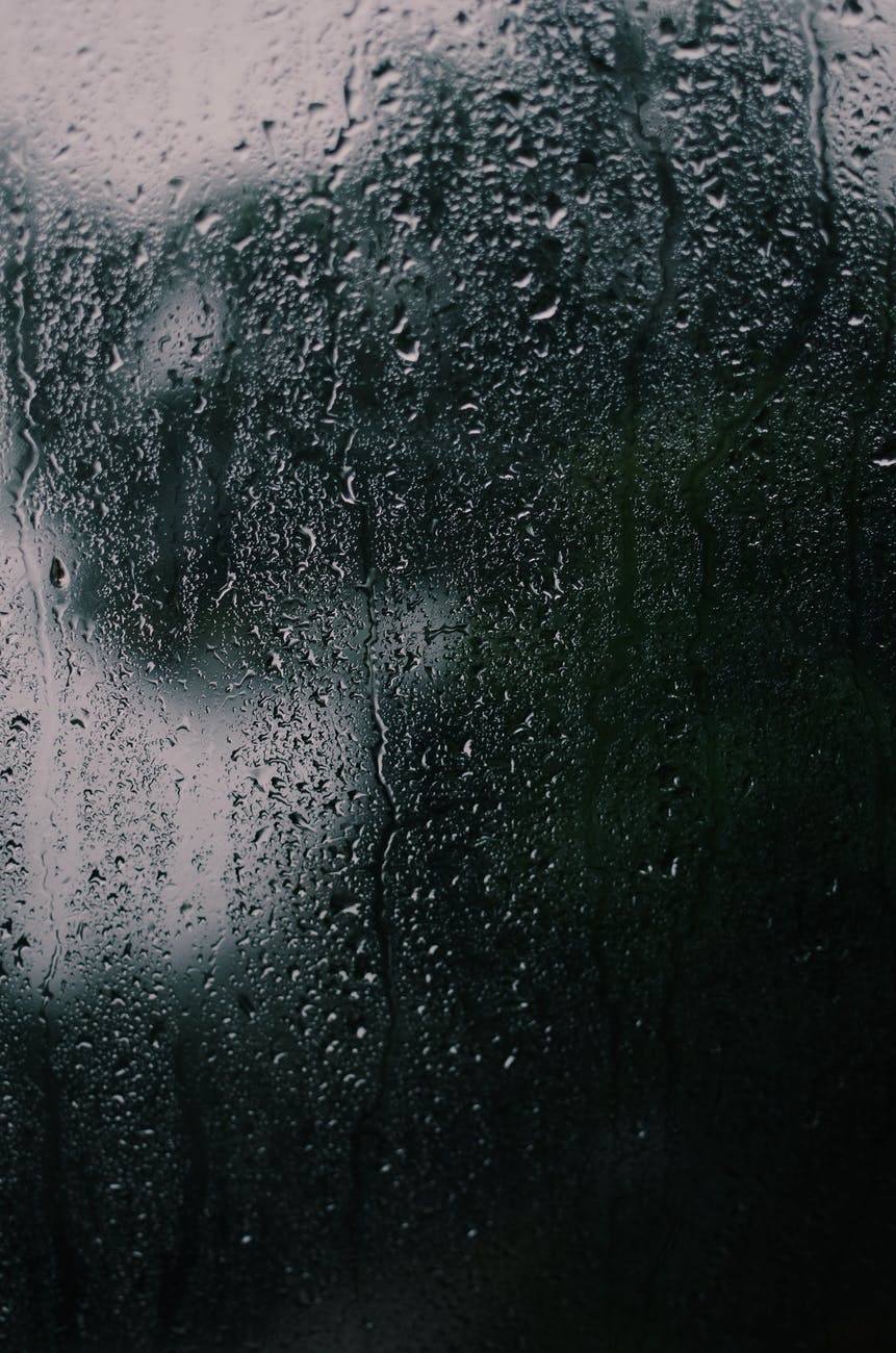 shadow reflection on glass with dripping water