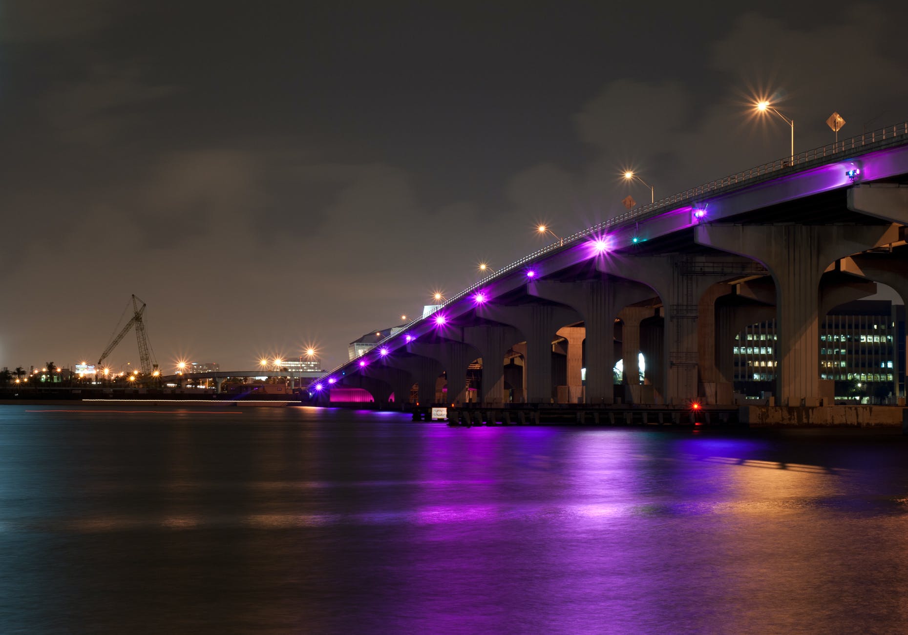 bridge over river under clear night sky