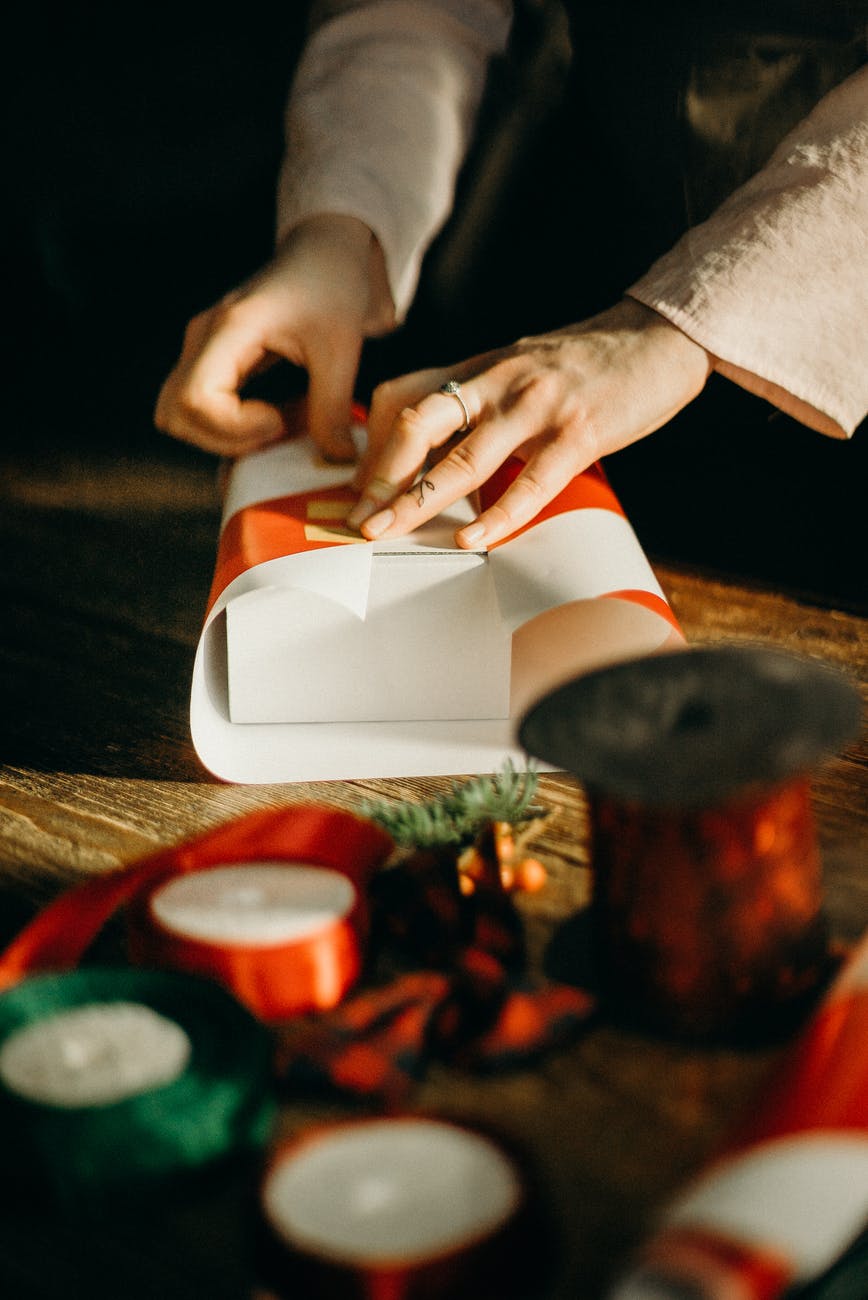 person wrapping white box