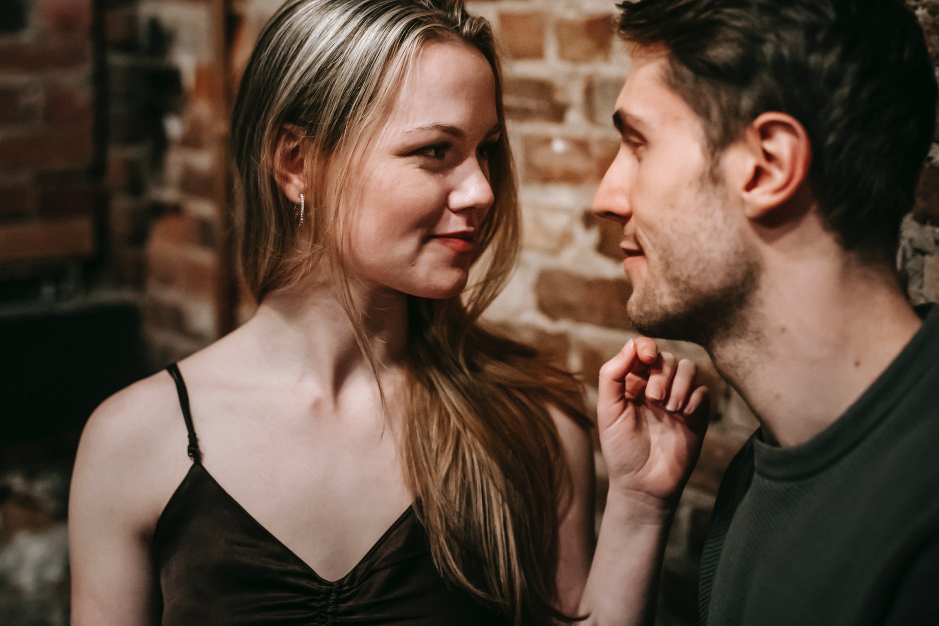 young couple talking while having date in cafe