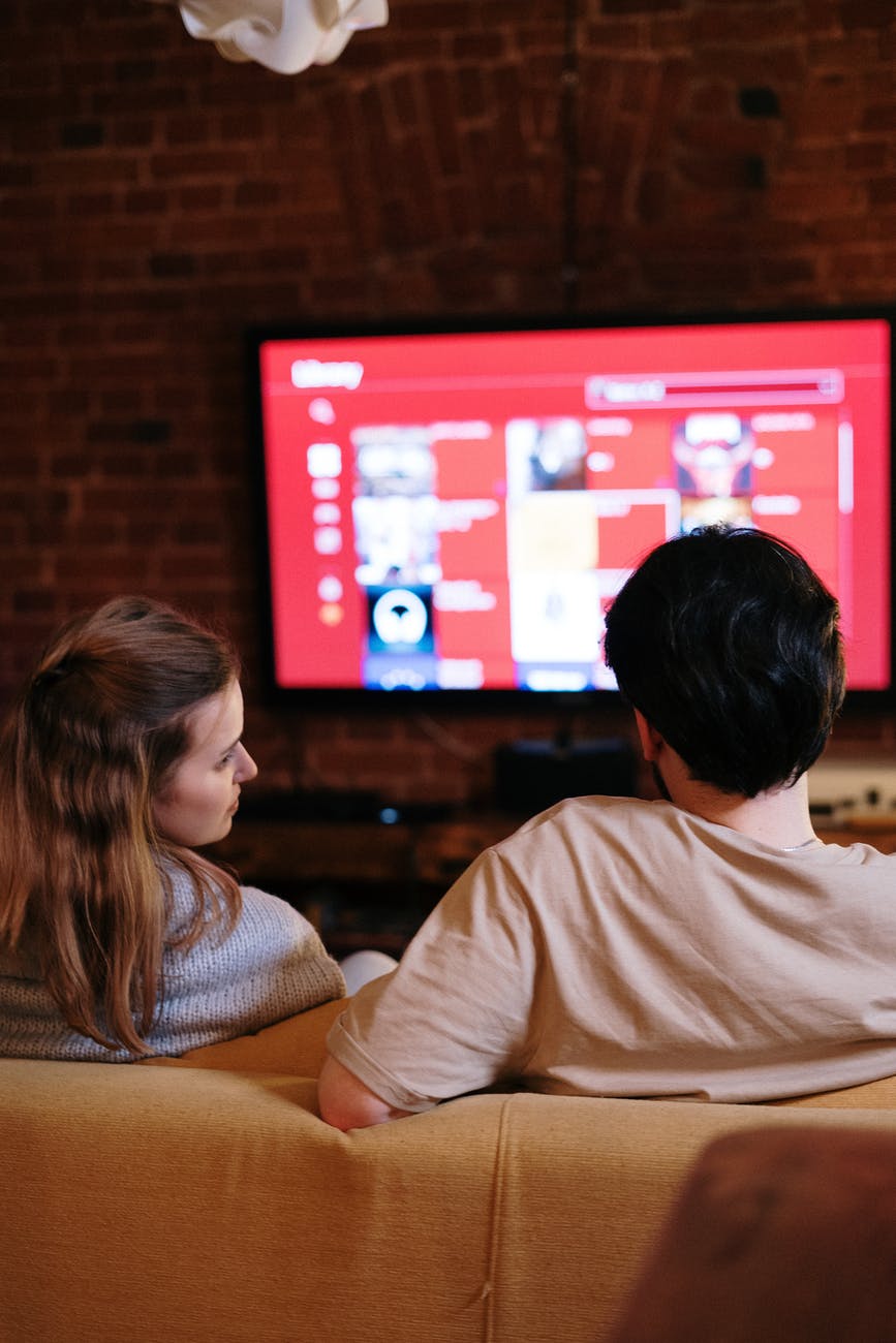 couple watching on a television