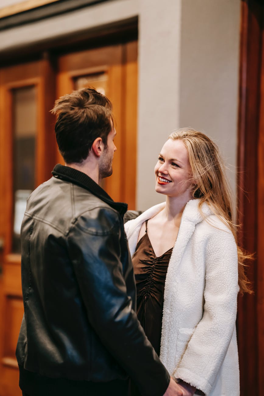 cheerful woman with anonymous boyfriend