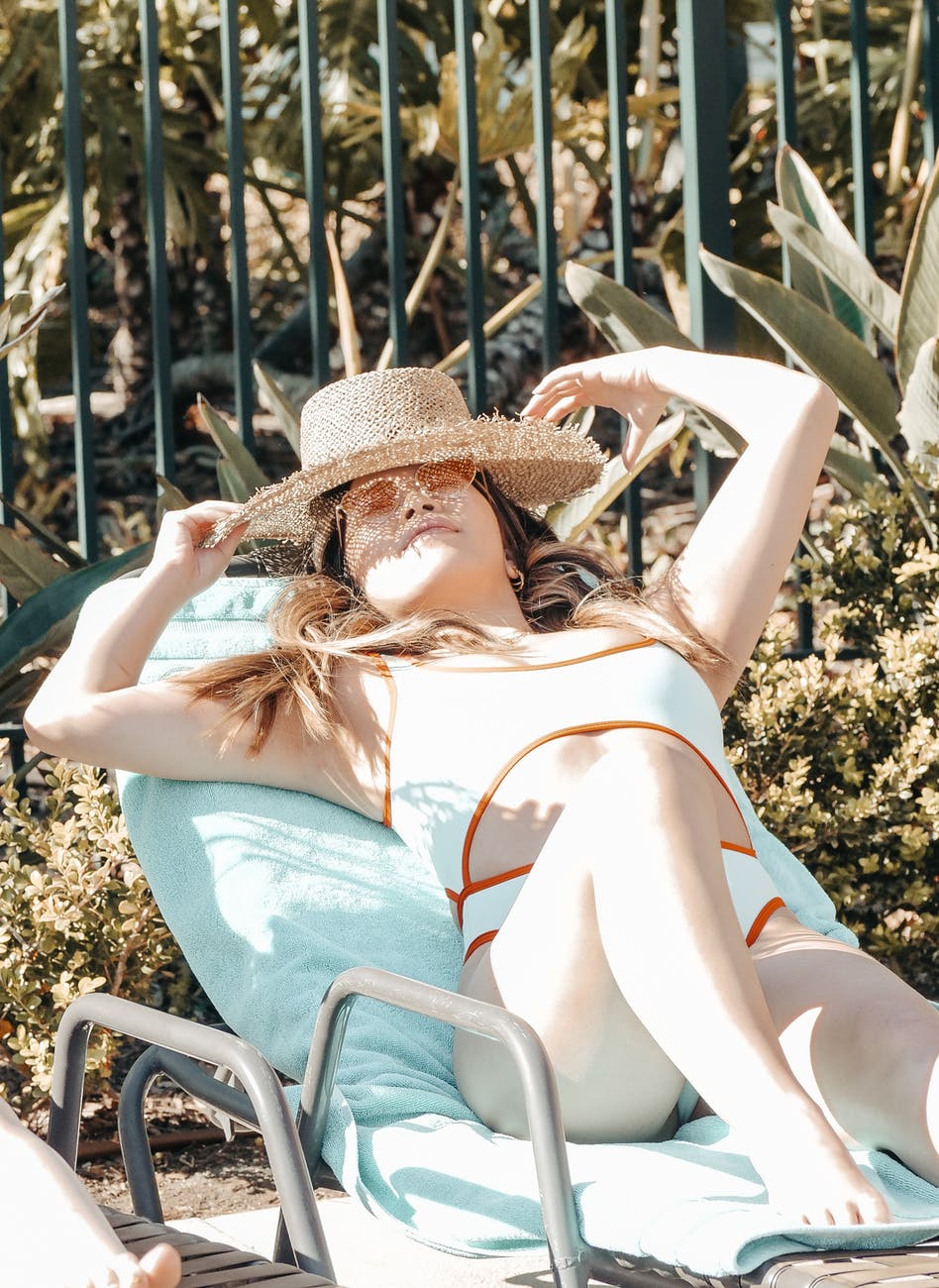 woman chilling and relaxing on sun lounger