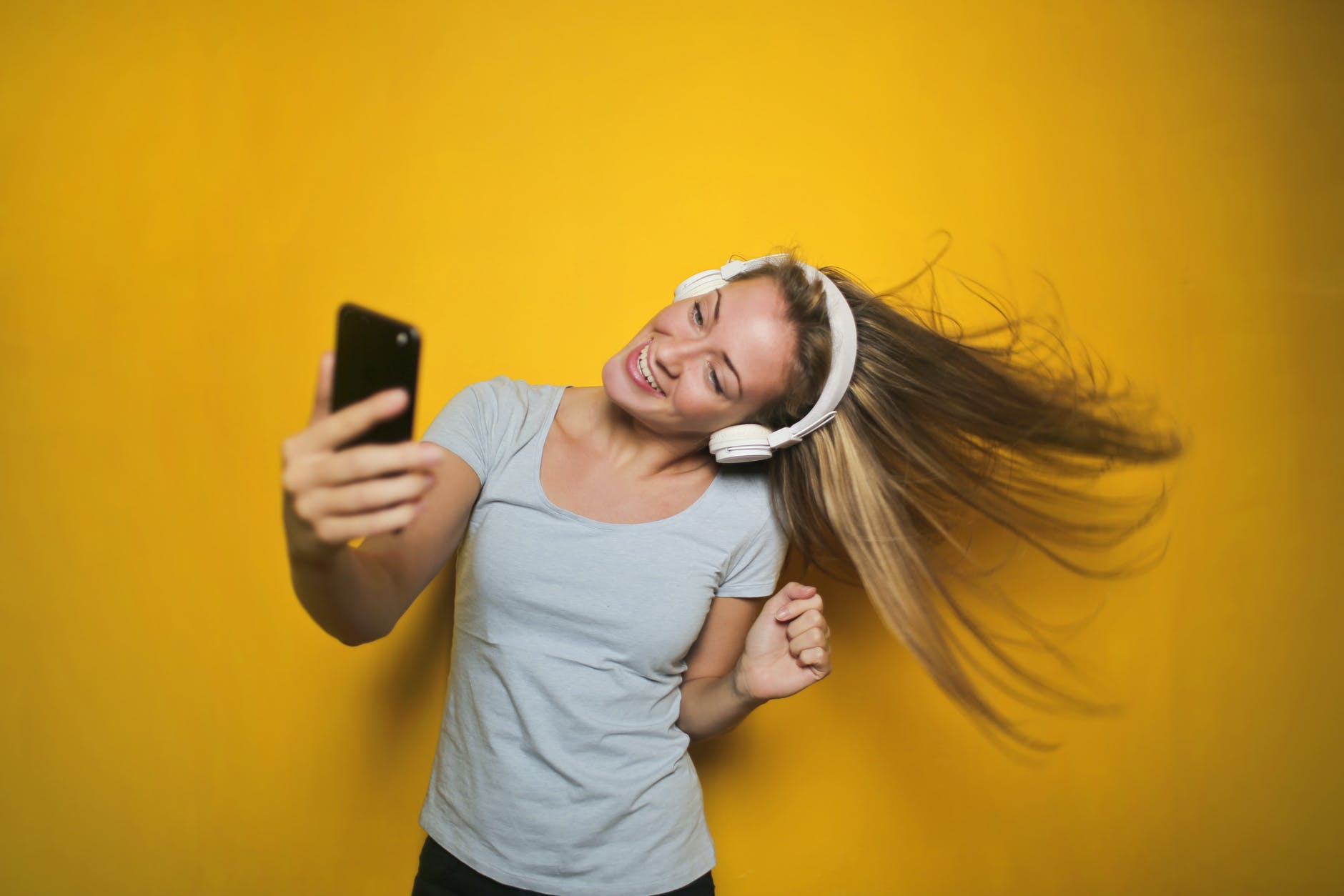 photography of a woman listening to music