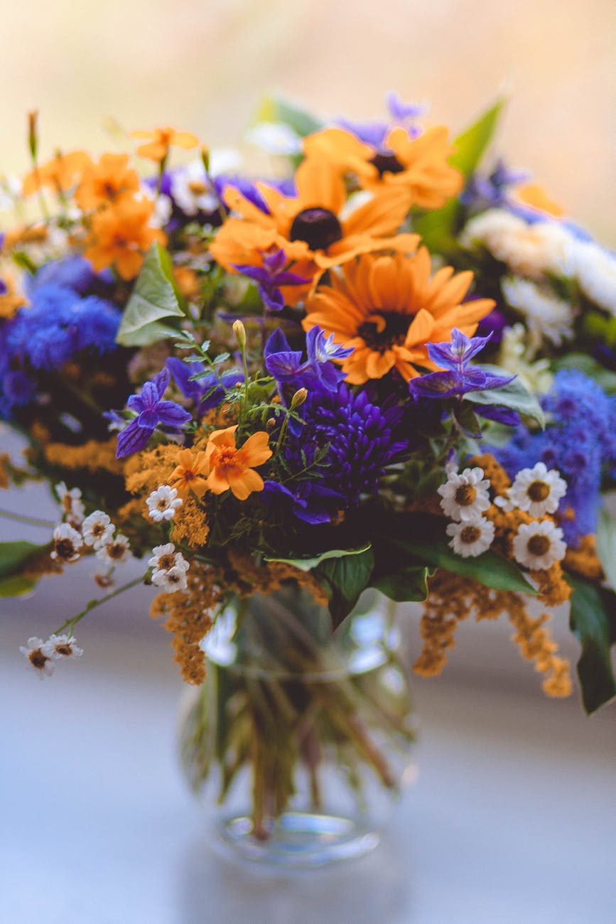 orange purple green and white flowers decor