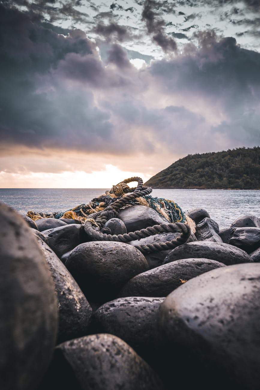 rope on rocks near ocean