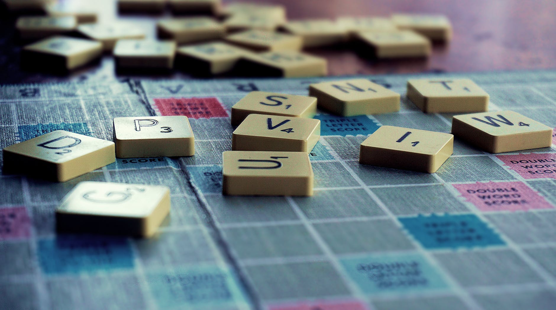 scrabble board game on shallow focus lens