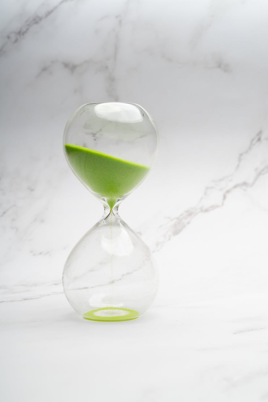 a hourglass with green sand